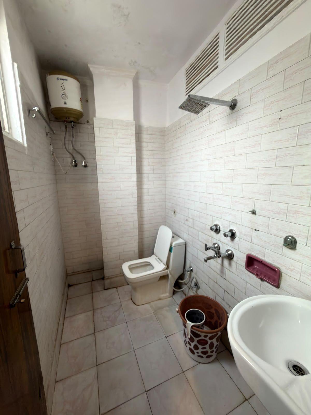 Attached bathroom of the double room, with WC, basin and geyser