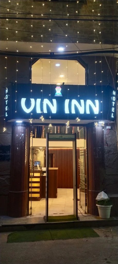 Hotel Vin Inn illuminated entrance sign at night