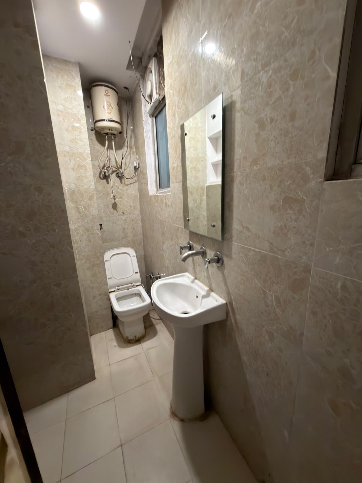 Attached bathroom of the twin room, with WC and wash basin
